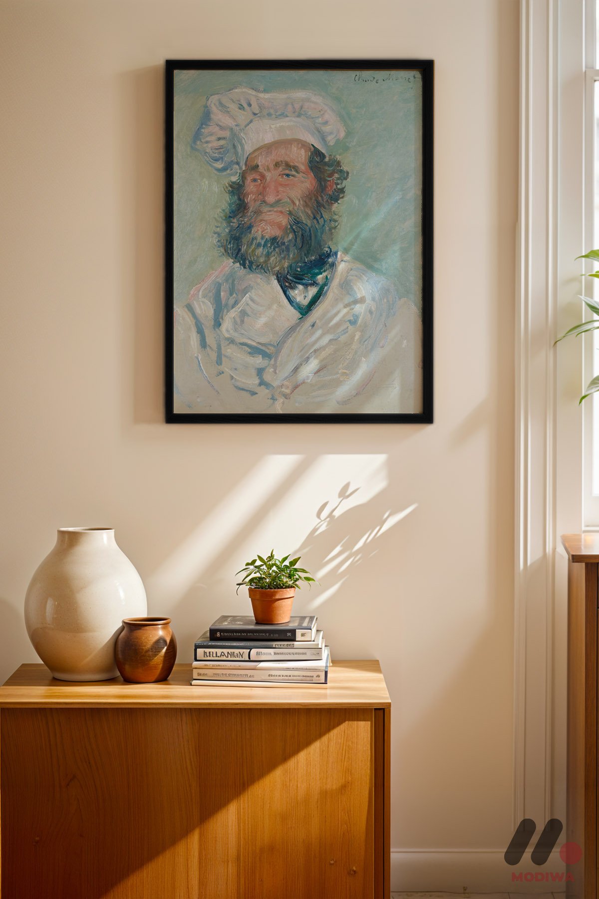 Claude Monet Aşçı Portresi siyah çerçeveli duvar tablosu, konsol üstündeki duvarda
