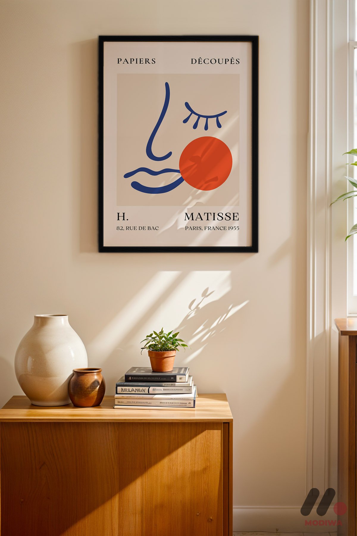 Matisse Yüz ve Daire siyah çerçeveli duvar tablosu, konsol üstündeki duvarda