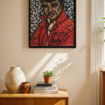 Kırmızı Ceketli Portre Pop Art siyah çerçeveli duvar tablosu, konsol üstündeki duvarda